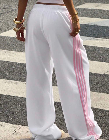 Muchica Women's White Striped Knitted Sweatpants Extra Long Straight
Leg Pink Side Stripe Loose Fit Casual Track Pants For Everyday Wear White Beach Pants White Wide Leg Pants Women Wide Pants Wide Leg Summer Pants Palazzo Pants Women White Track Pants Wo