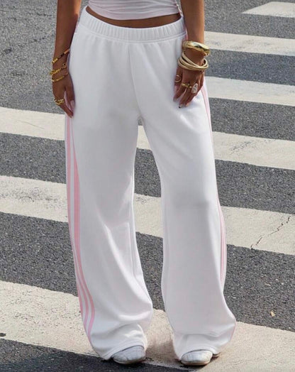 Muchica Women's White Striped Knitted Sweatpants Extra Long Straight
Leg Pink Side Stripe Loose Fit Casual Track Pants For Everyday Wear White Beach Pants White Wide Leg Pants Women Wide Pants Wide Leg Summer Pants Palazzo Pants Women White Track Pants Wo